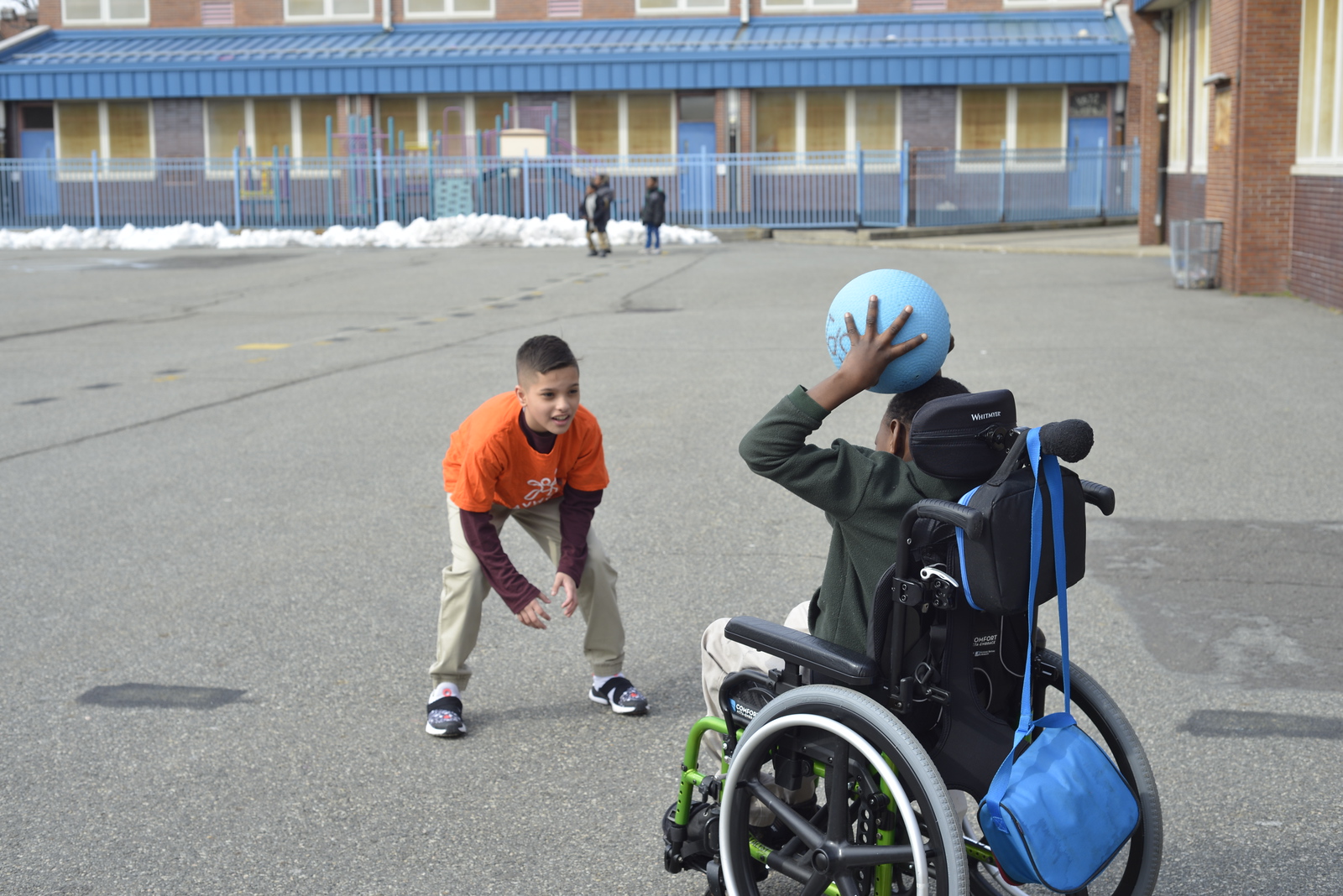 two kids playing with ball