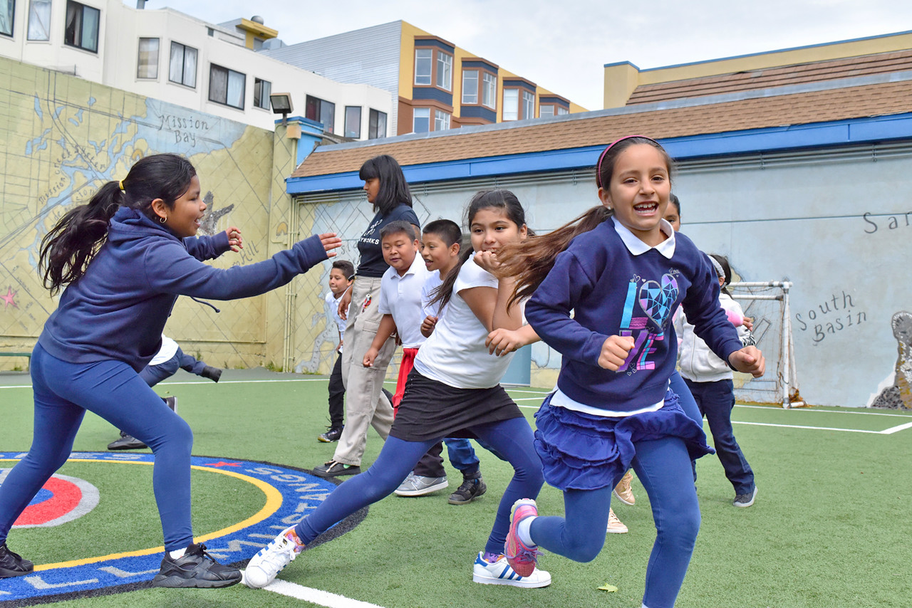 girls playing tag