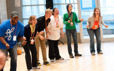 Playworks coaches participating in indoor games