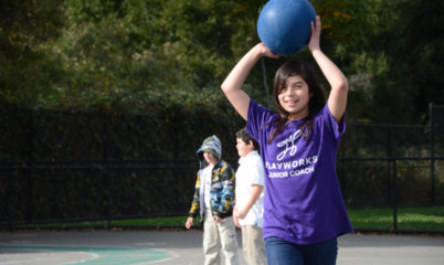 Junior Coach holding ball